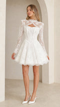 Front view of model wearing white floral lace cutout corset mini dress with long sleeves