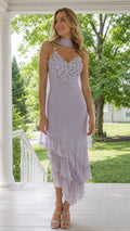 Front view of lavender floral applique asymmetrical ruffle midi dress with scarf