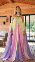 Front view of model wearing pastel ombre halter maxi gown with metallic collar and dramatic flowing sleeves