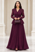 Front view of model wearing burgundy lace peplum formal maxi dress with clutch