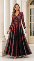 Model wearing Black and Red embellished long sleeve V-neck tulle evening gown front view