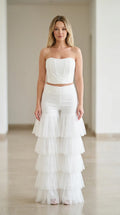 White strapless corset top and tiered tulle flare pants two-piece set front view