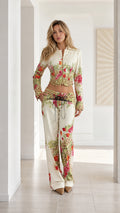 Front full view of woman wearing Cream floral leopard print cropped jacket and wide leg pants set