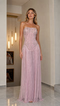 Front view of model wearing pink strapless beaded fringe gown