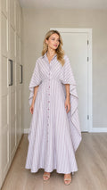Front view of woman wearing lavender striped button-down cape sleeve maxi dress