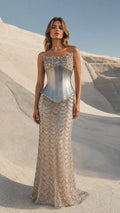 Front view of model wearing Silver strapless beaded maxi evening gown with metallic corset waist