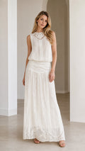 Front view of woman wearing white boho lace maxi dress