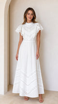 Front full-length view of white lace trim flutter sleeve maxi dress
