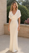 Front view of model wearing ivory cowl neck capelet satin maxi dress