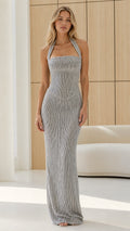 Front view of model wearing silver halter neck maxi dress