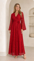 Front full-length view of model wearing a red floral lace wrap maxi dress with bell sleeves