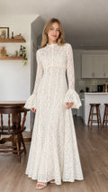 Model wearing white all-over lace long sleeve maxi dress from the front