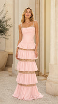 Front view of model wearing pink tiered sequin maxi dress