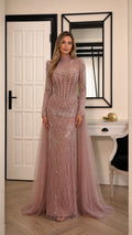 Front view of model wearing dusty rose high neck beaded evening gown with tulle train