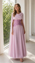 Front view of woman wearing lilac chiffon cape sleeve evening dress with embroidered waist