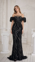 Front view of black sequined illusion mermaid evening gown with draped off-the-shoulder sleeves