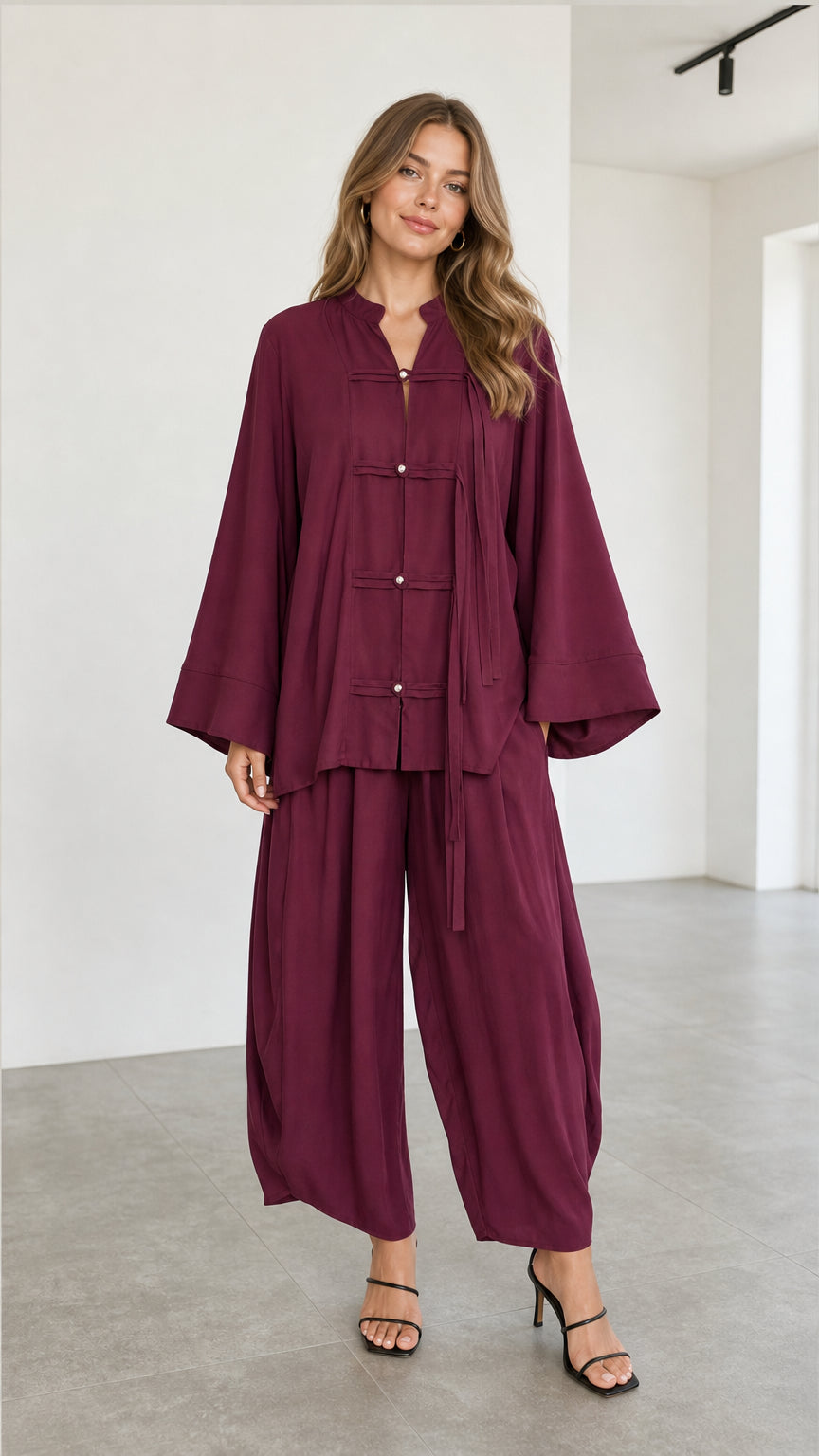 Front full view of women's burgundy Zen style tunic top and matching lantern pants set
