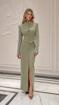 Front view of model wearing sage green stand collar jacket and maxi skirt set