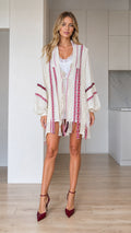 Front view of woman wearing ivory boho embroidered tassel open-front kimono cardigan
