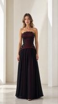 Front full view of burgundy strapless beaded basque waist evening gown