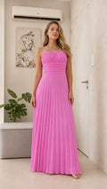 Front view of model wearing the fuchsia pleated maxi dress