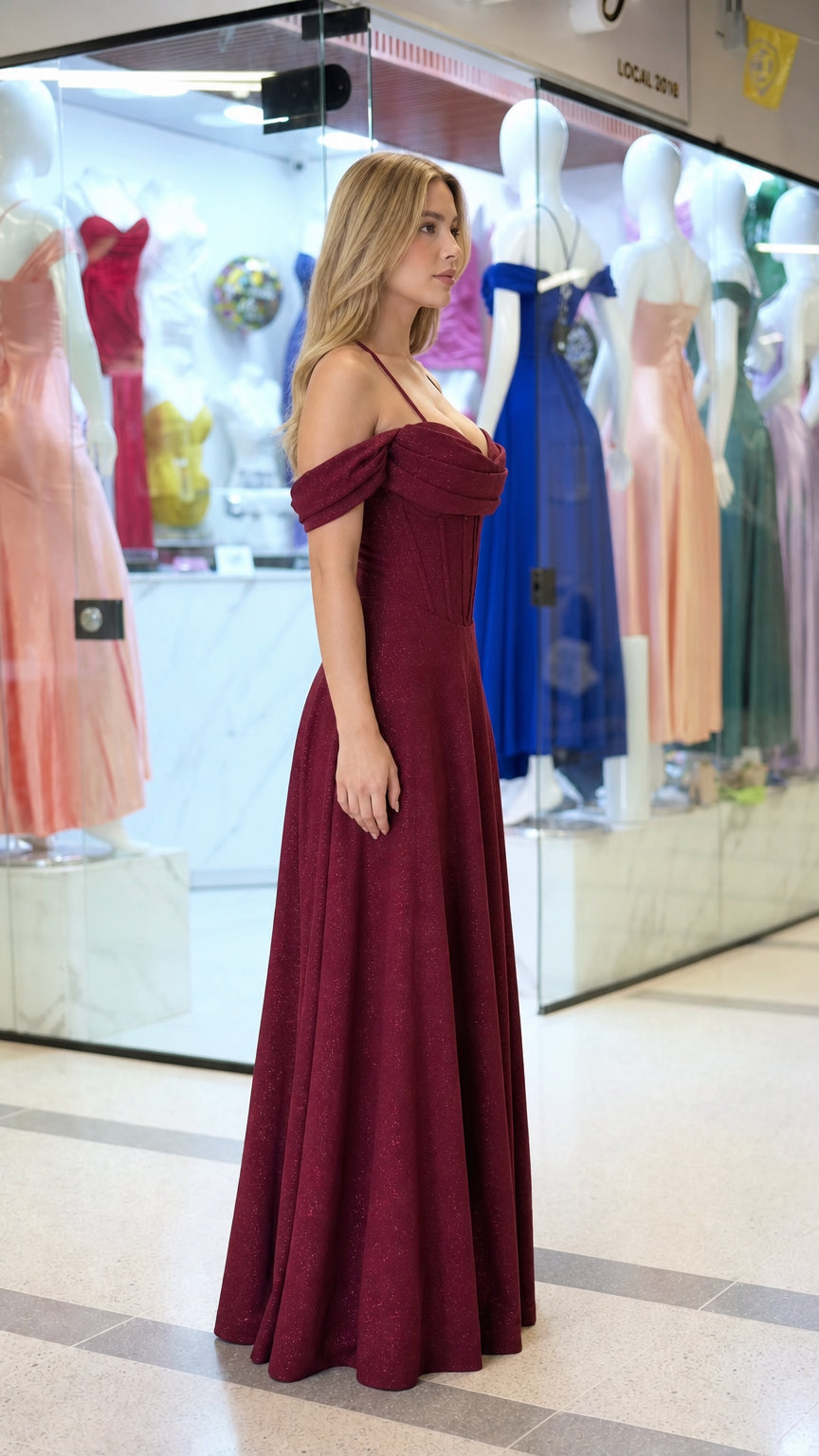 Side profile view of burgundy evening gown