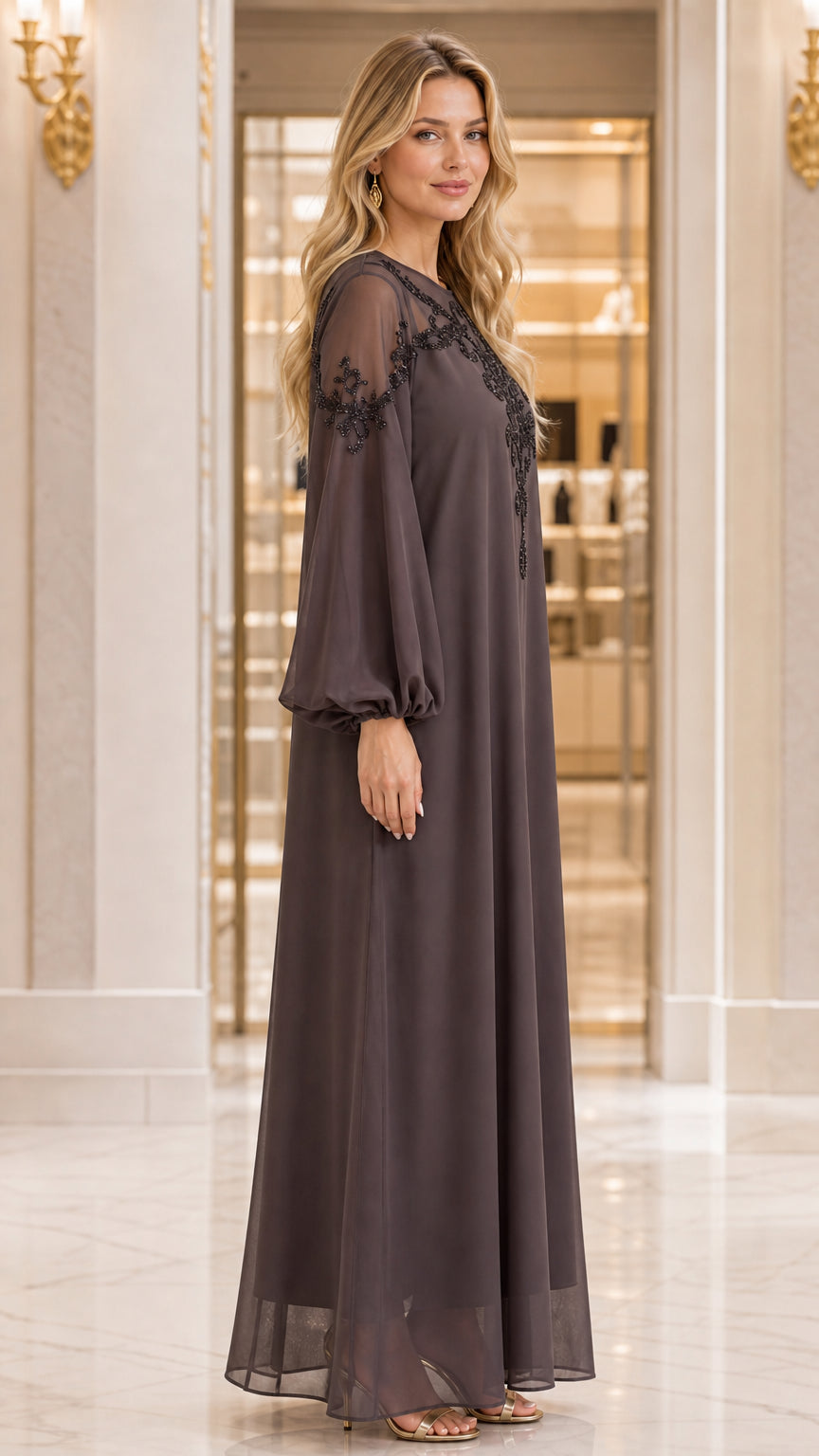 Side profile view of woman wearing Dark Taupe beaded chiffon kaftan gown