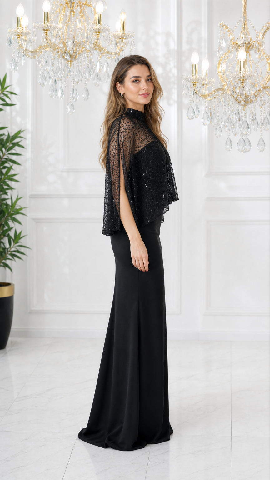 Side angle view of model wearing black sequin cape formal maxi dress