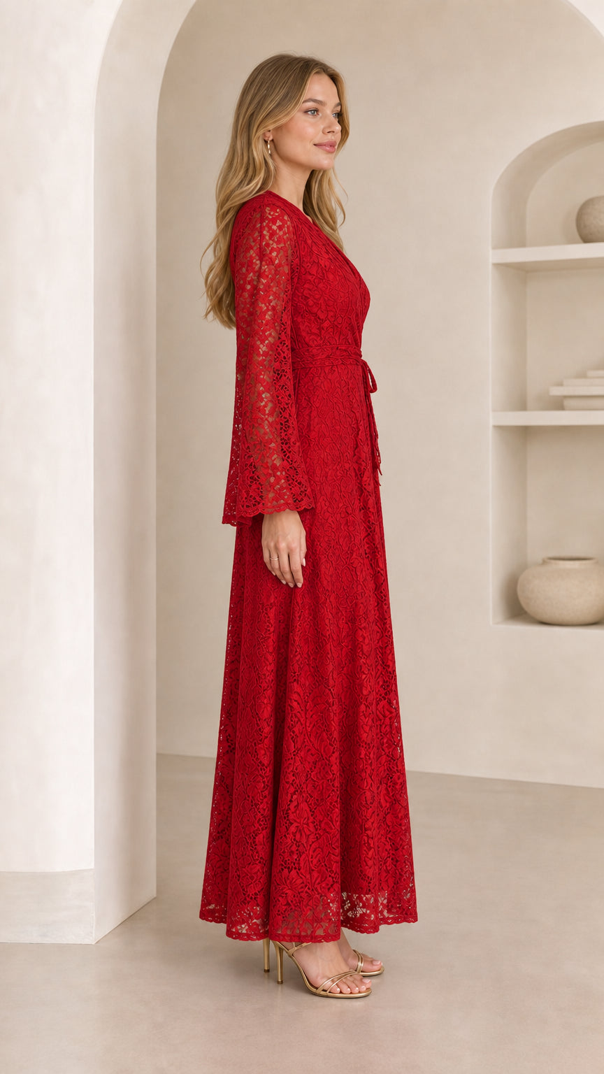 Side profile view of model wearing a red floral lace long sleeve maxi dress