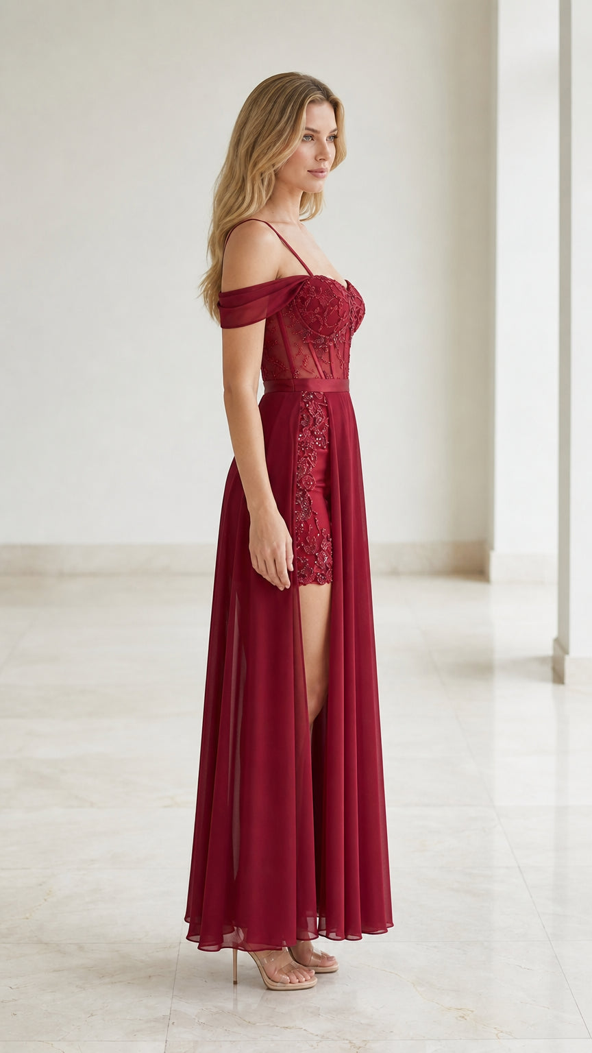 Side view of burgundy formal gown with high slit