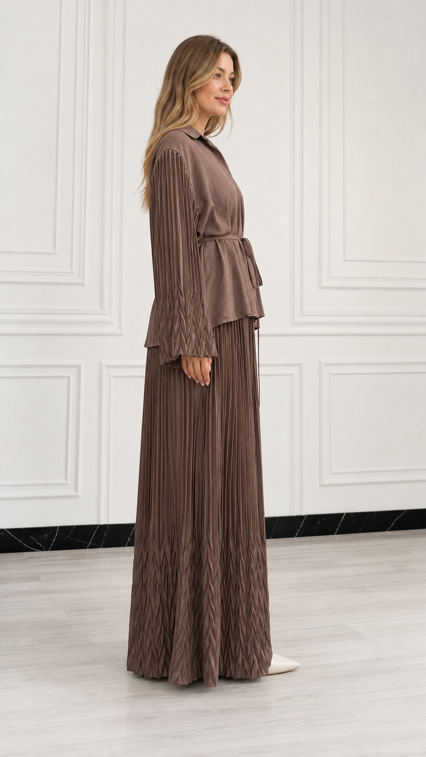 Side view of woman wearing Mocha Brown pleated matching two-piece set