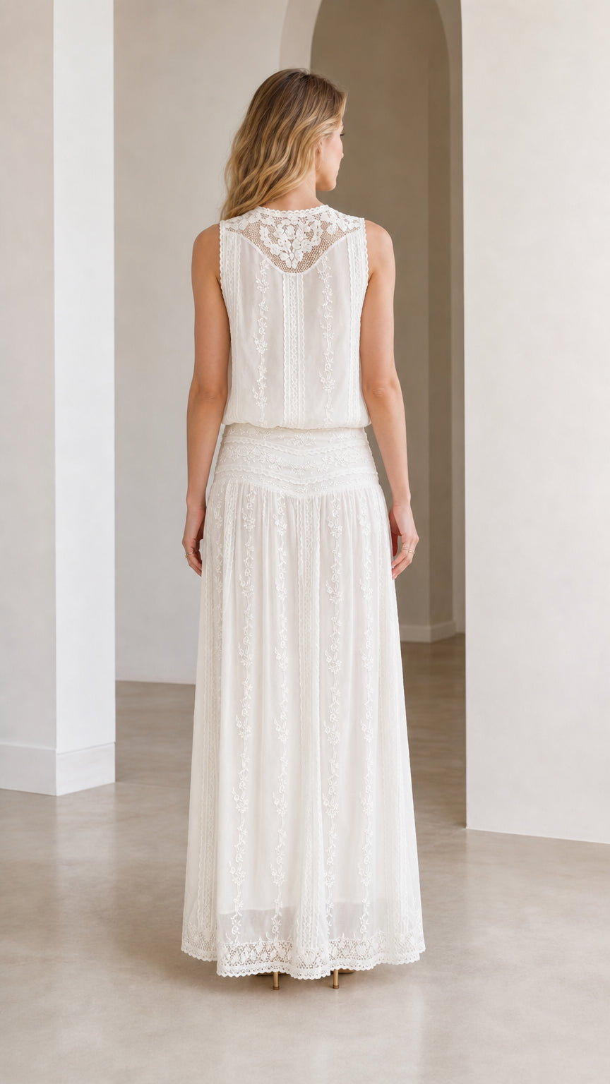 Back view of white lace maxi dress showing detailed neckline