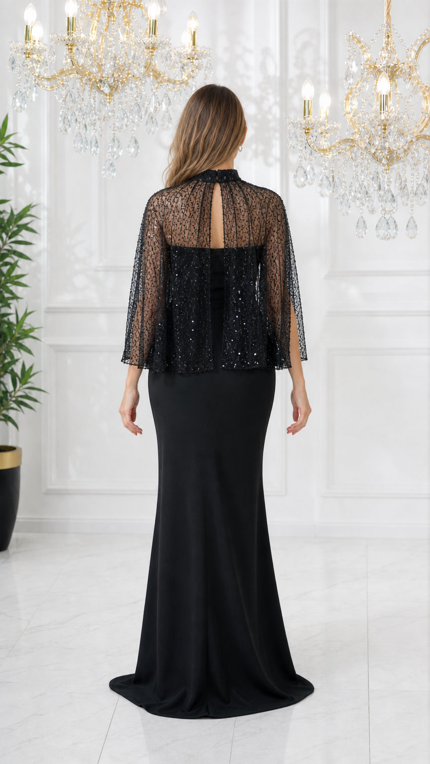 Back view of black high neck sequin capelet gown showing keyhole closure