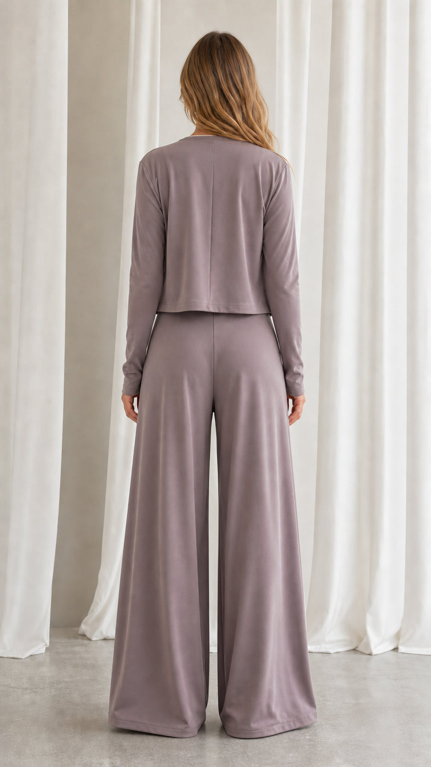 Back view of women's dusty mauve matching athleisure set showing relaxed wide-leg fit