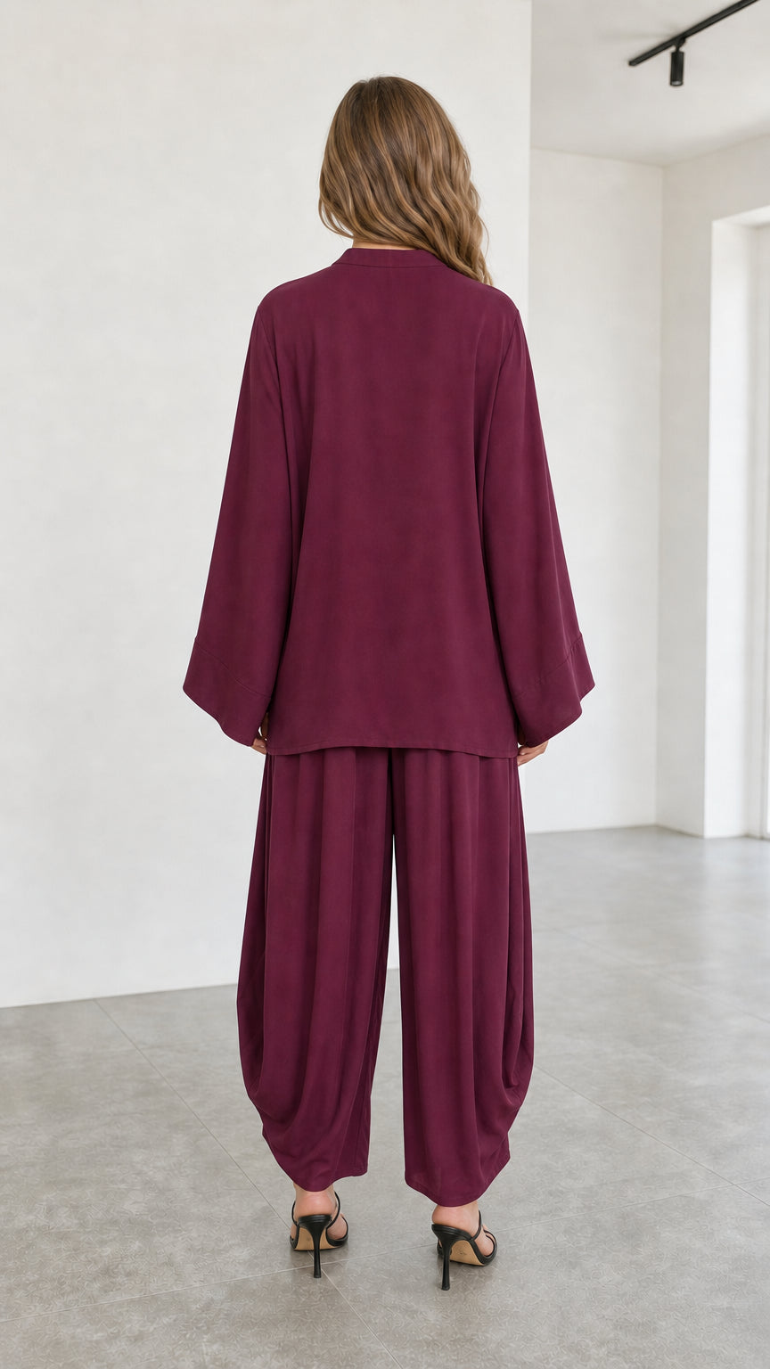 Back view of flowy burgundy two-piece matching top and lantern pants set