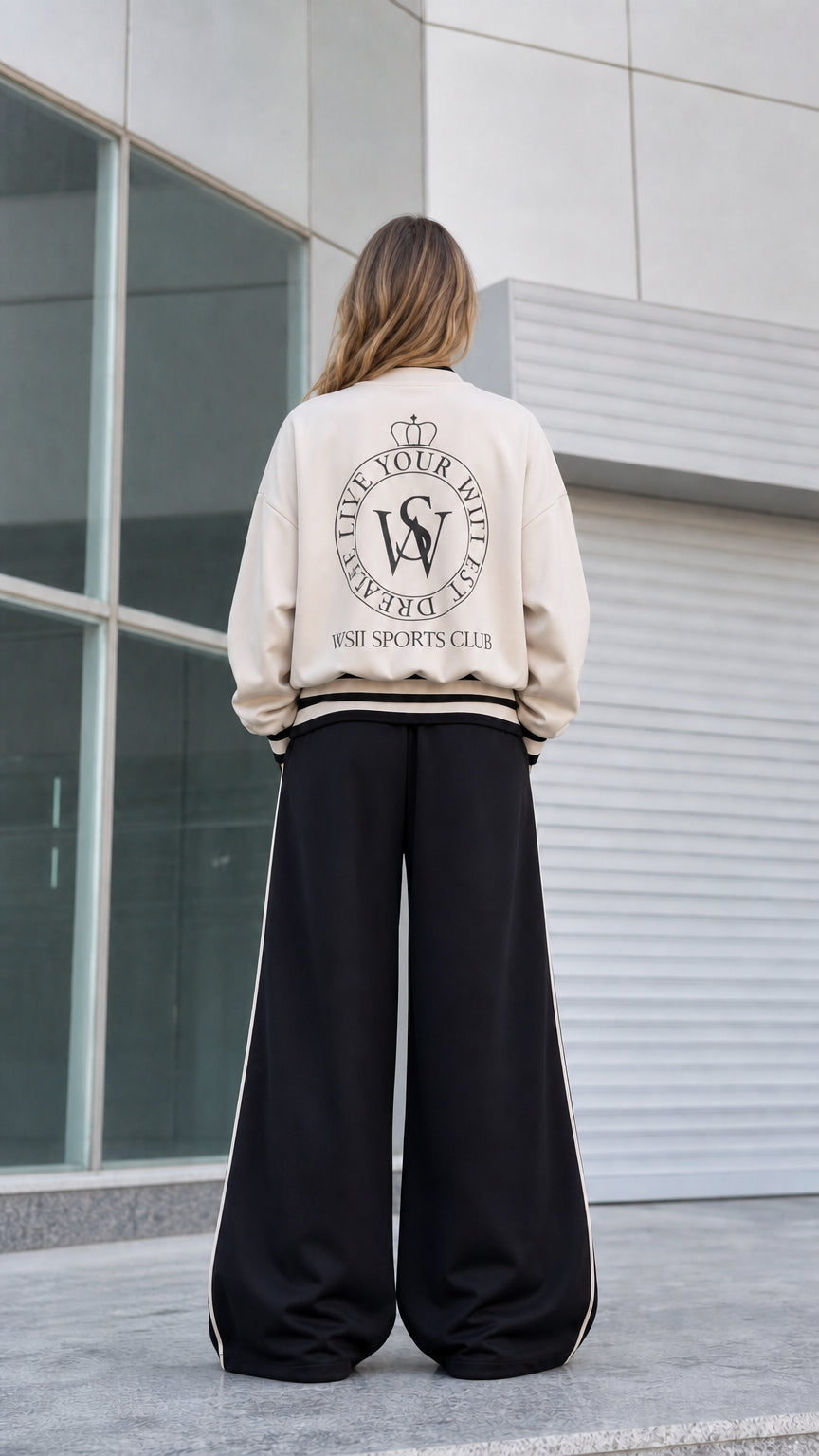 Back view of beige bomber jacket showing vintage sports club crest print