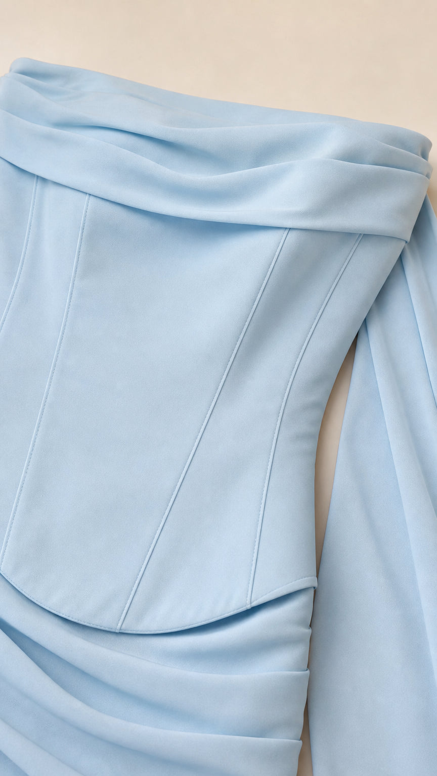 Close-up detail of the boned corset bodice and draped scarf neckline