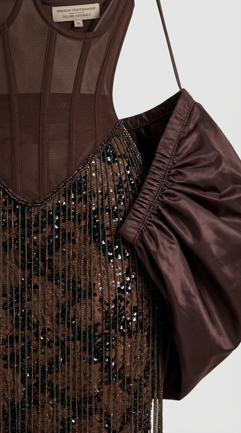 Close-up detail of structured corset boning, sequin embroidery, and puff sleeve