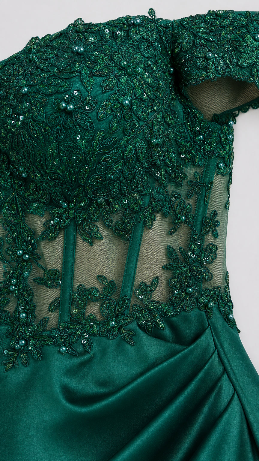 Close-up detail of green beaded lace bodice and mesh paneling