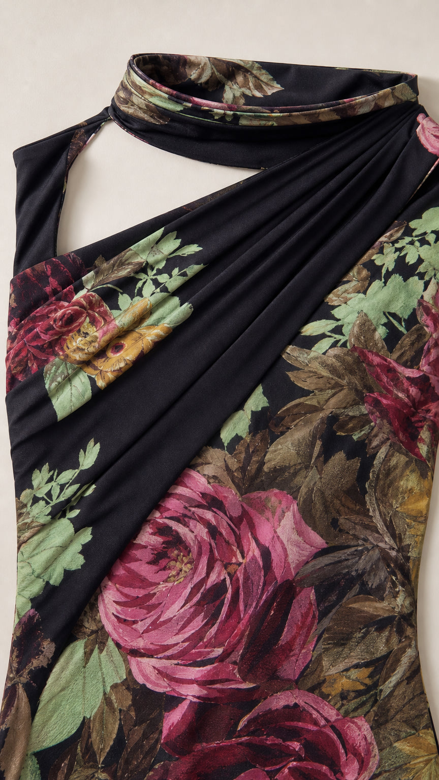 Close up of ruched bodice and high neck detail on black floral gown