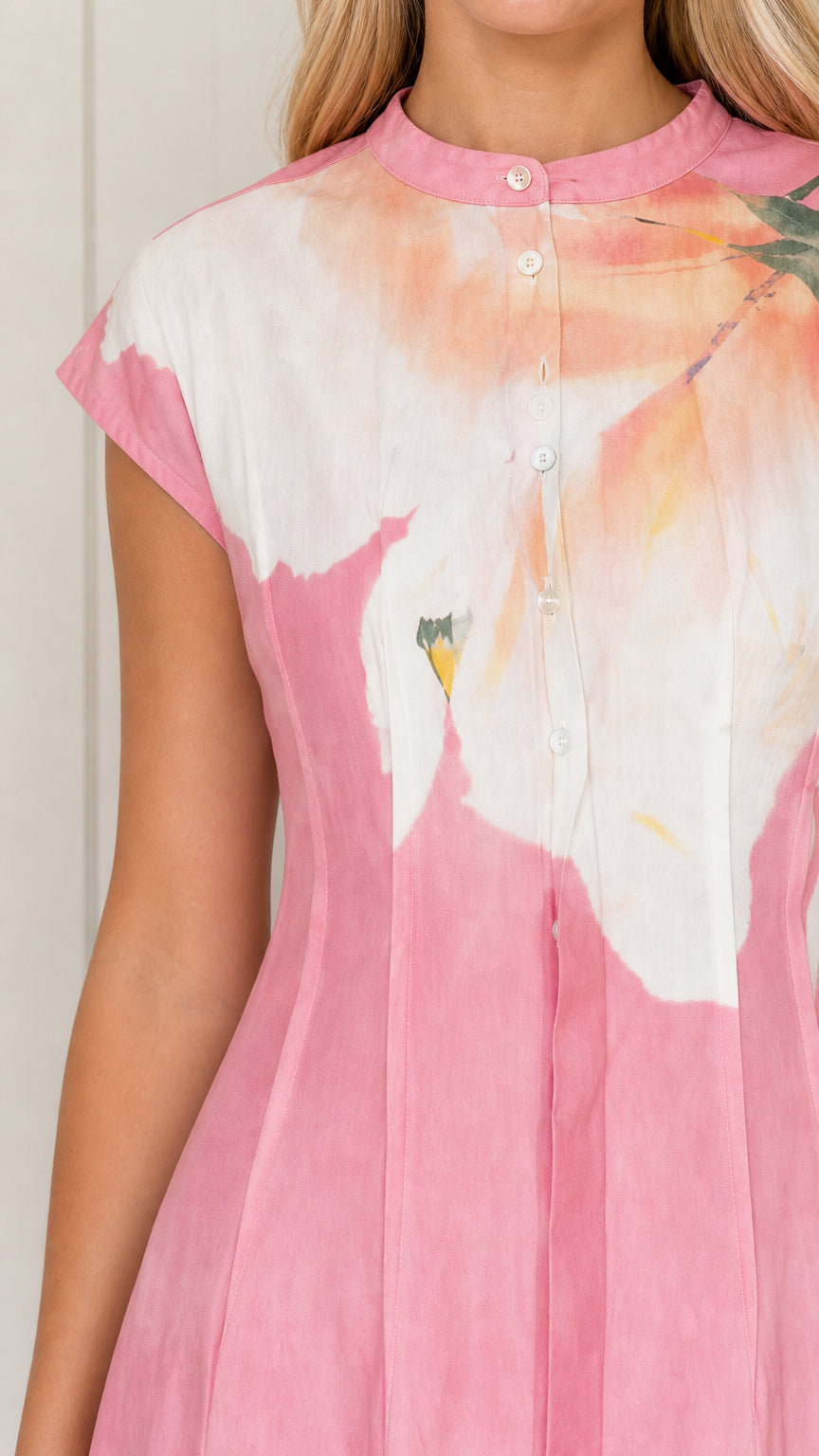 Close-up detail of mandarin collar, button placket, and cap sleeves on pink floral dress
