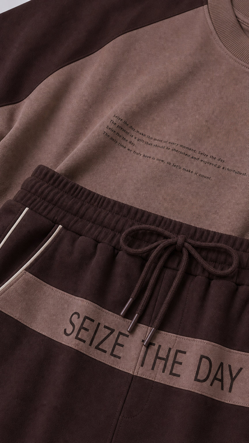 Close-up detail of 'SEIZE THE DAY' drawstring waistband and graphic chest print